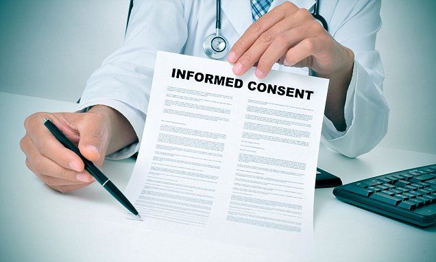Doctor explaining consent form to patient before medical procedure